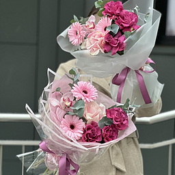 Букет Муза из роз сорта аскот, гербер, цимбидиума и эвкалипта